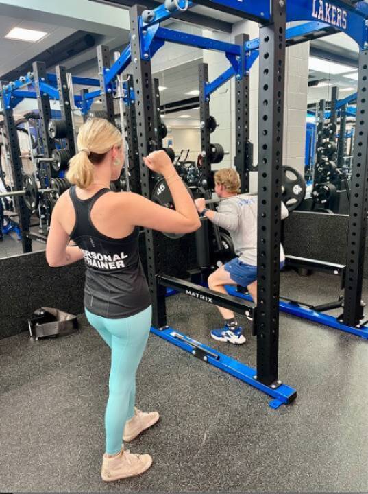 Trainer coaching a client.